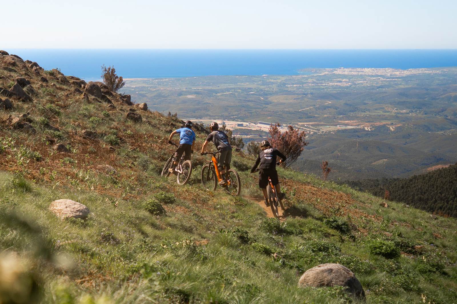 Mountain bike route descending from highland trails to the coast in Algarve